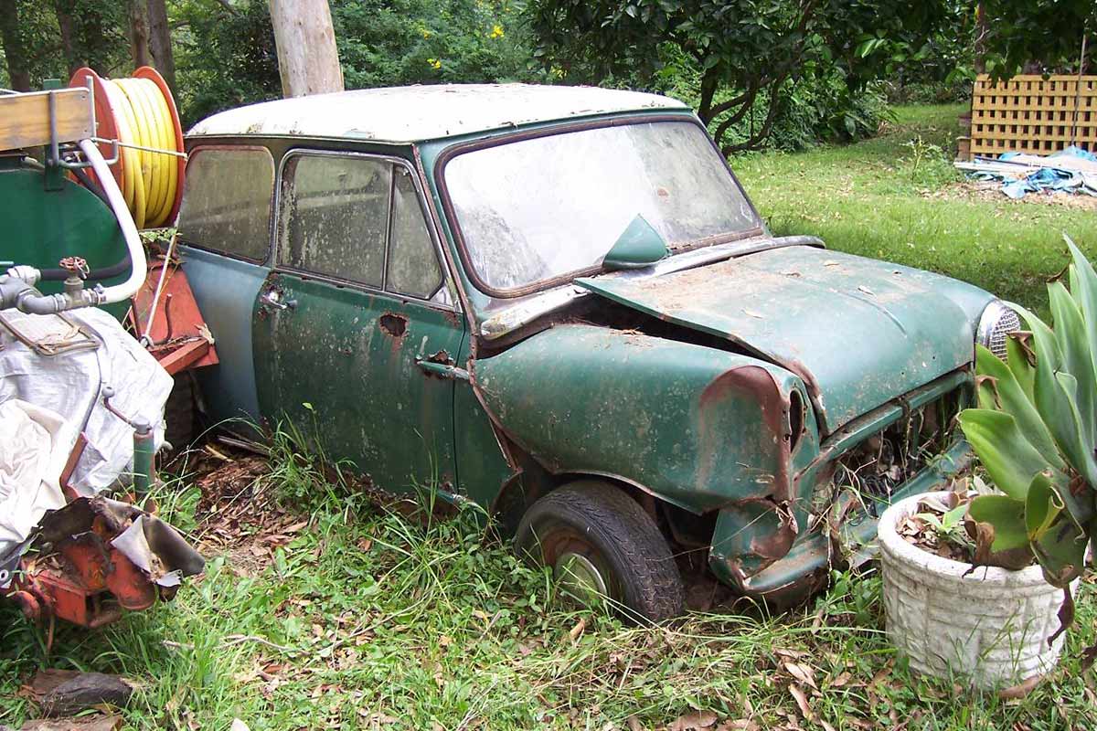 Derelict rusty MINI copper in backyard